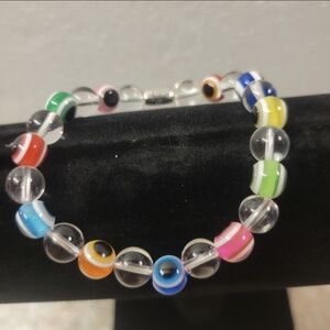 Silver and Different Colored Evil Eye Bead Stretch Bracelet